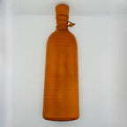 Side profile of eco-friendly clay water bottle with rope handle – 12 inch height
