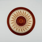 Top view of decorative clay pot lid with traditional Sri Lankan sun pattern